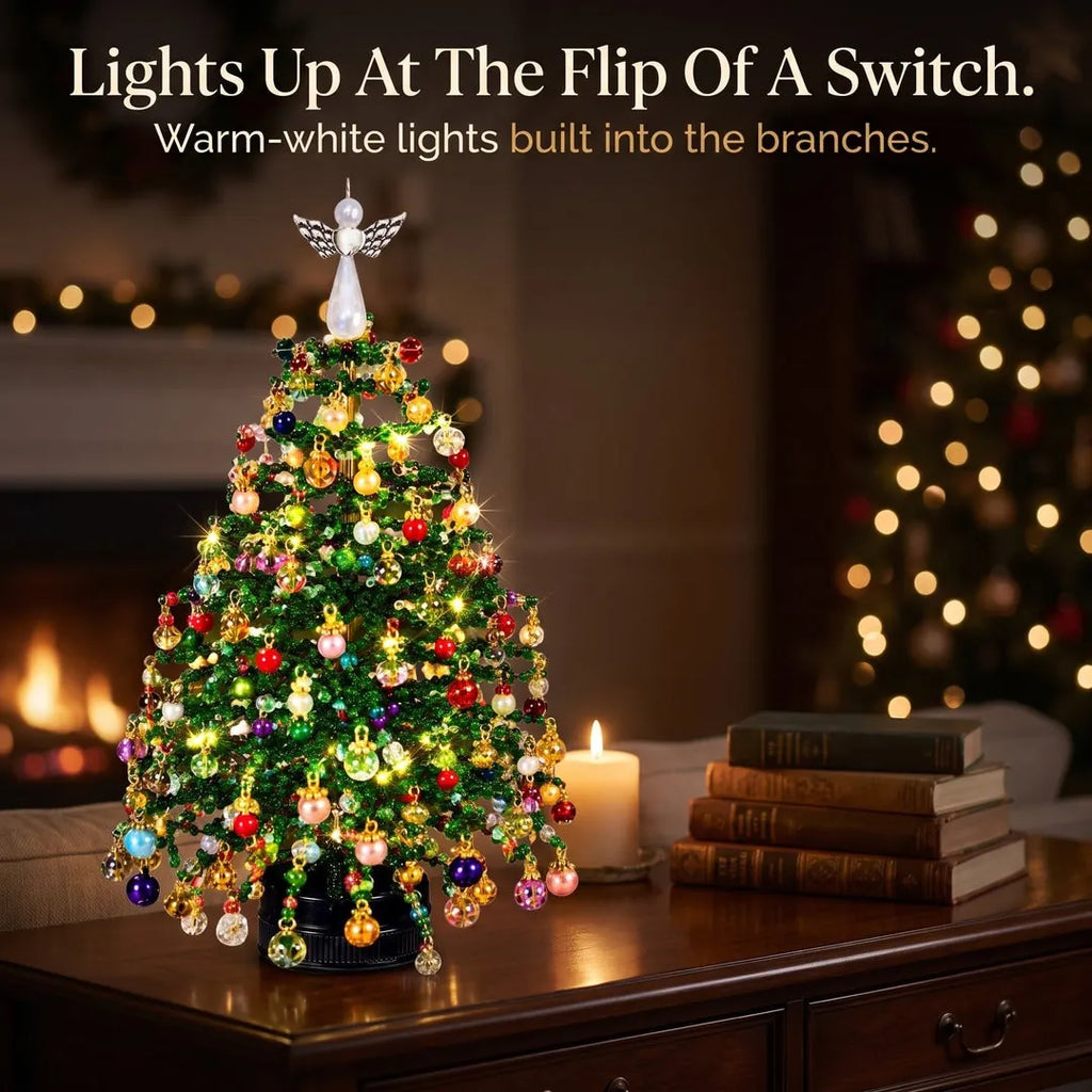 Fleva beaded Christmas tree kit lit up with warm-white lights on a table by the fireplace