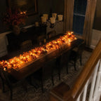 Autumn leaf garland as a glowing dining table centrepiece